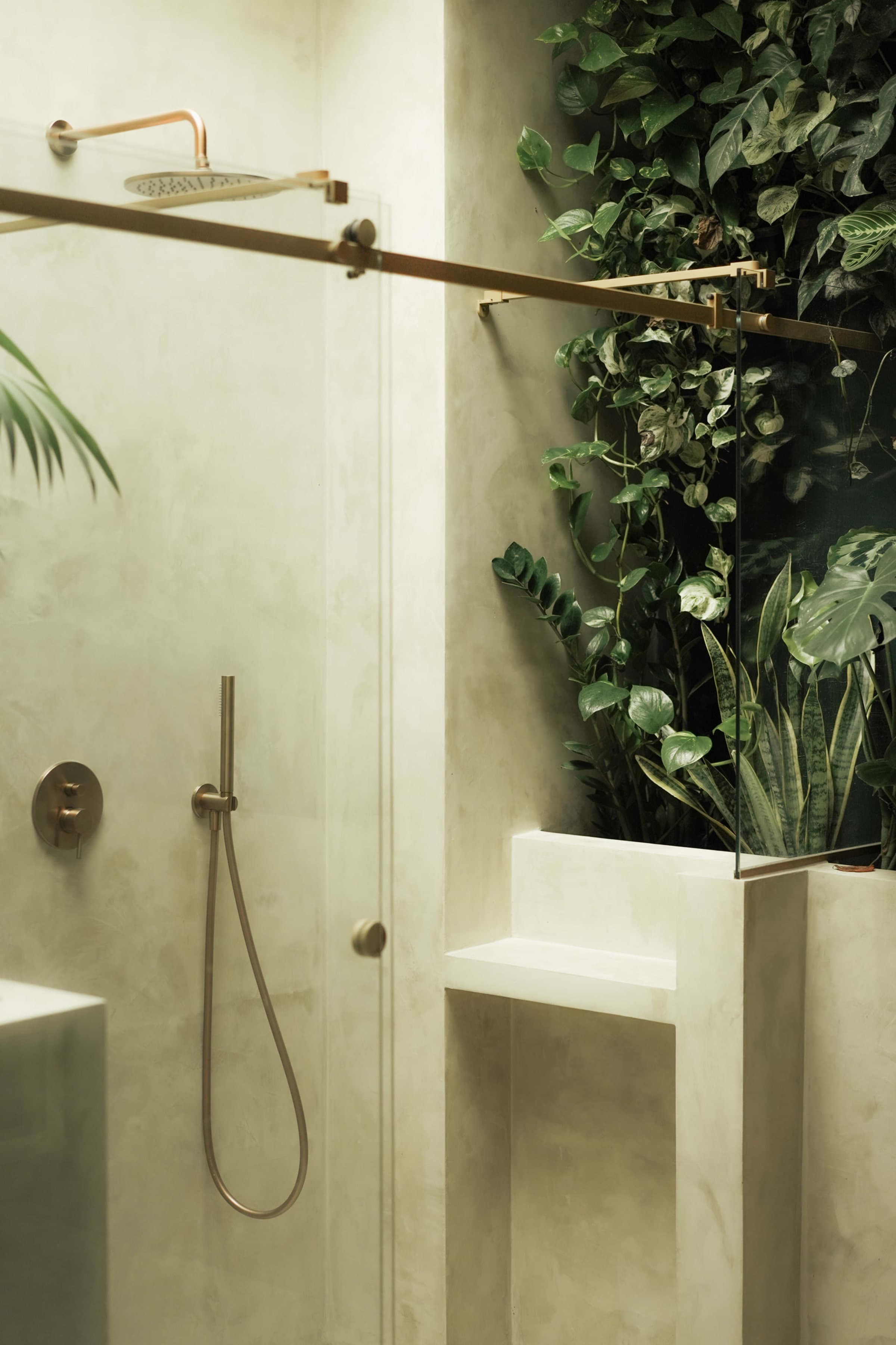 An open-air garden shower surrounded by planting at Quinta Filippa